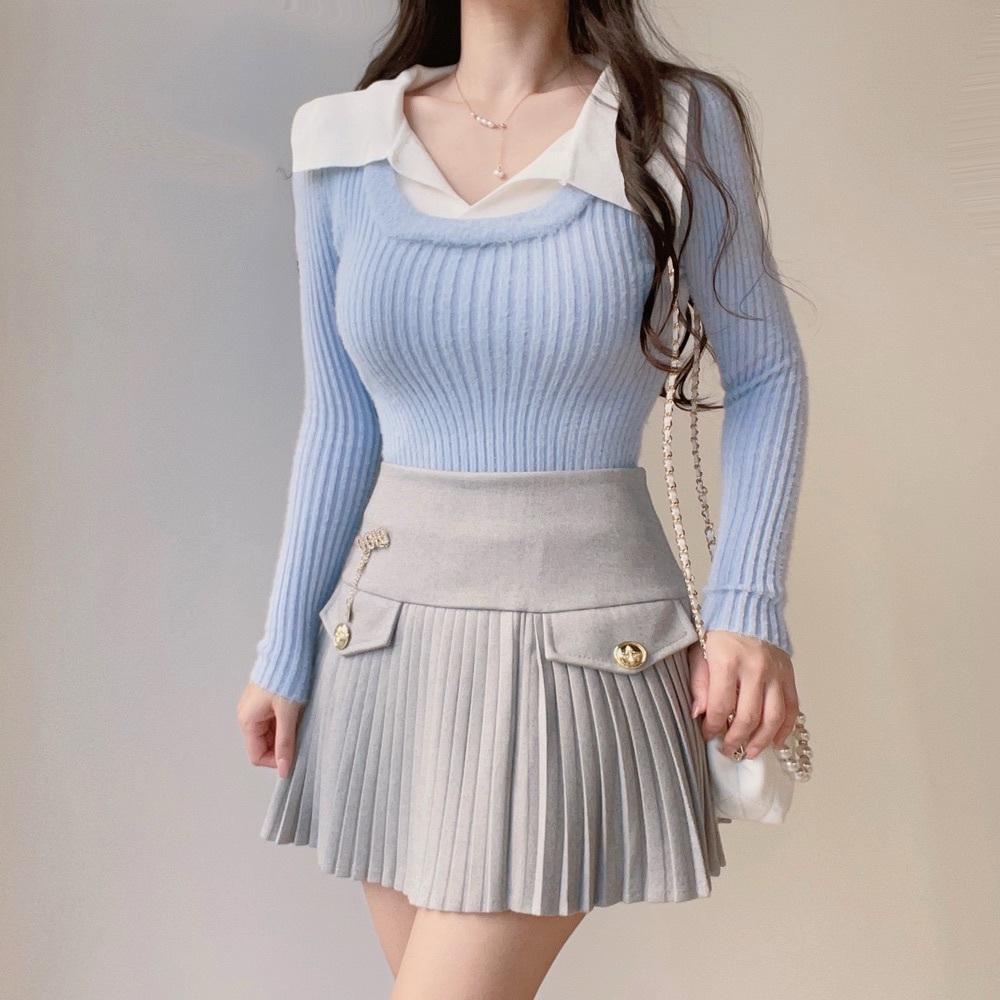 Gray pleated skirt with a classic preppy look featuring a matching brooch